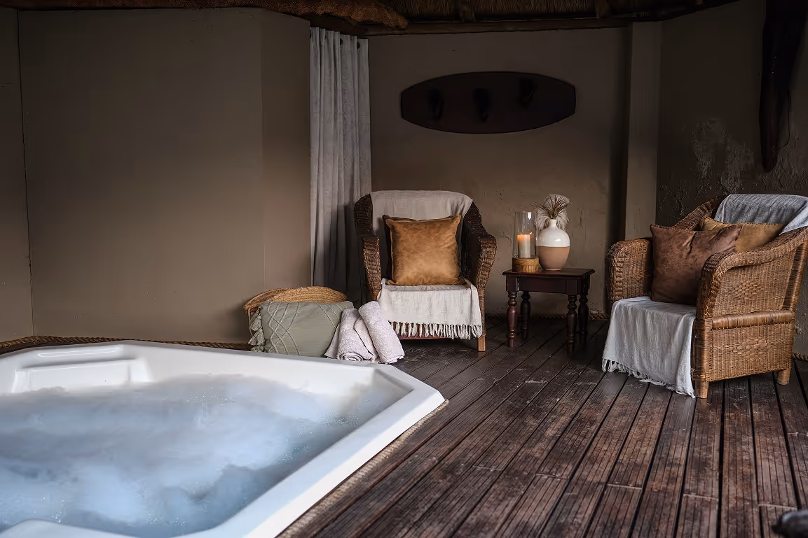 The deluxe lodge swimming pool surrounded by gardens